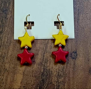 Red and yellow star shaped earrings
